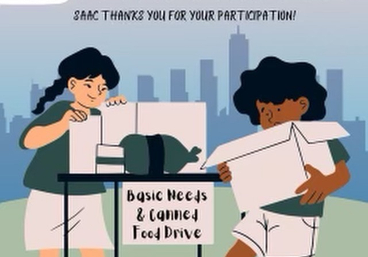 Student looking through donation boxes.