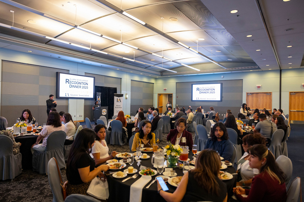 Guests seated and standing at the 2025 Alumni Scholarship Dinner