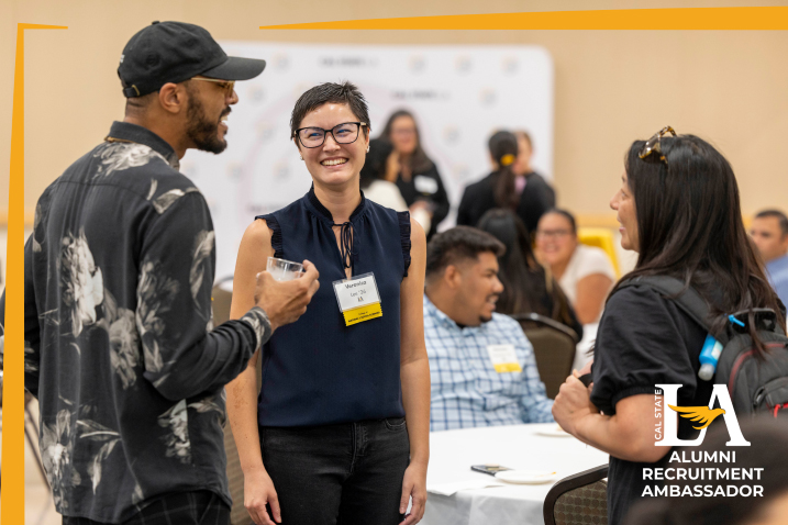 Woman laughing and talking to a group of people