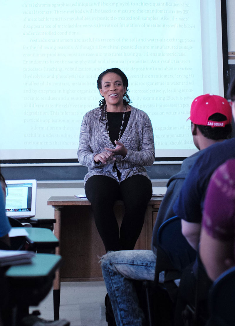 A professor giving a lecture to a class.