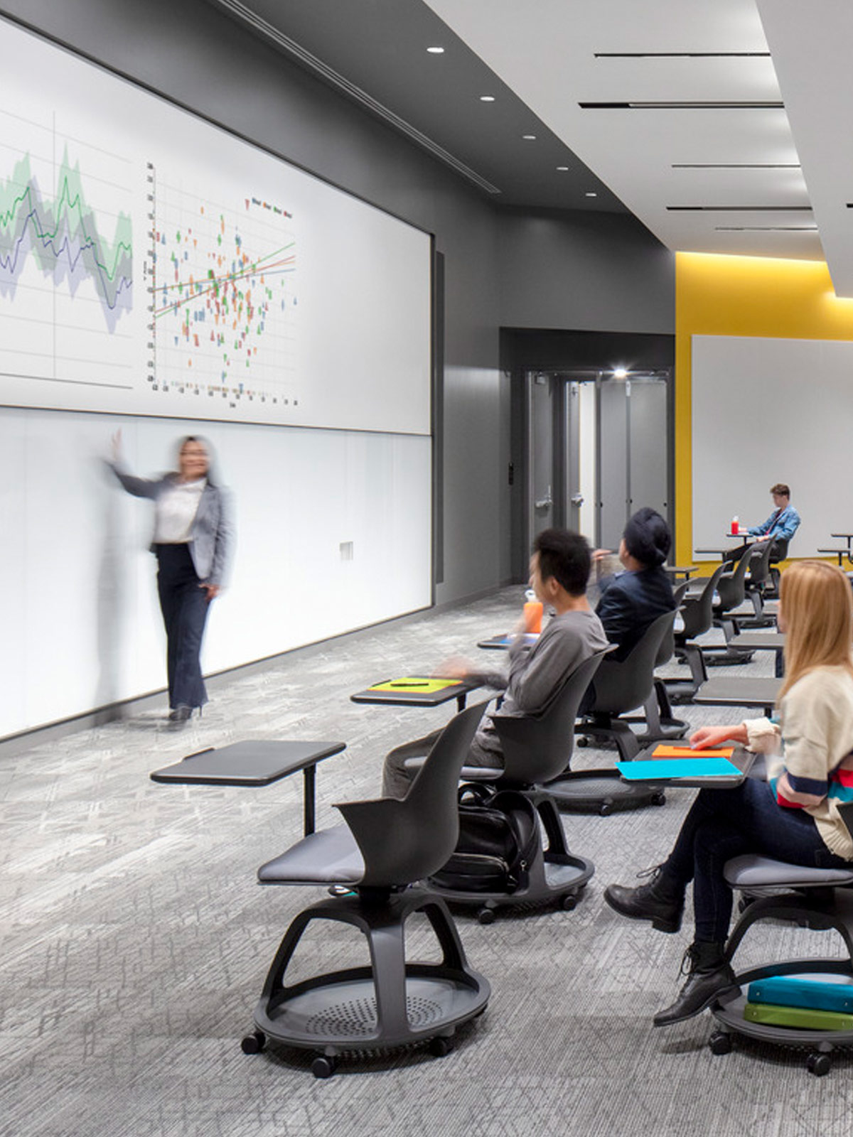 A professor giving a lecture to a class.