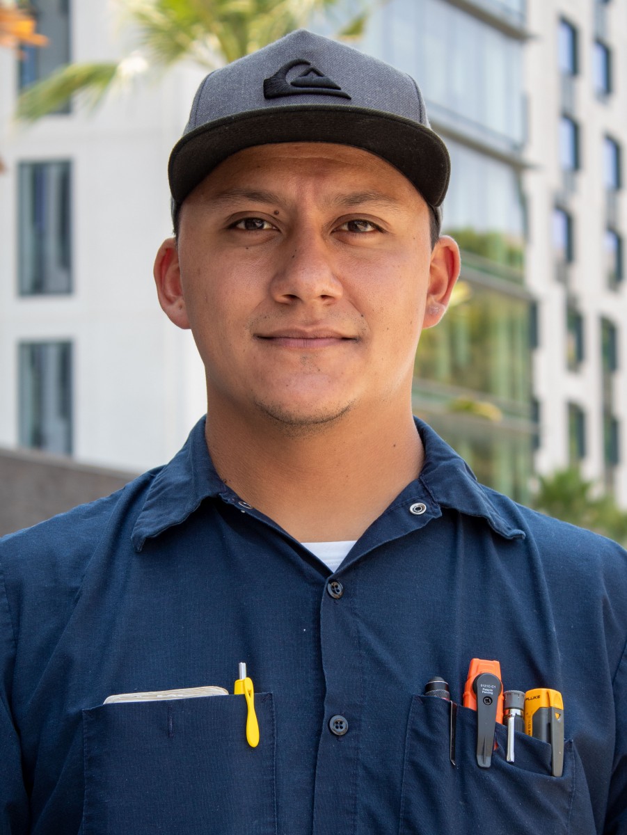 Person wearing a baseball cap.