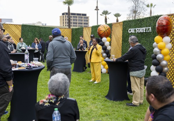 Cal State LA alumni and community gathered around President Eanes as she speaks. 