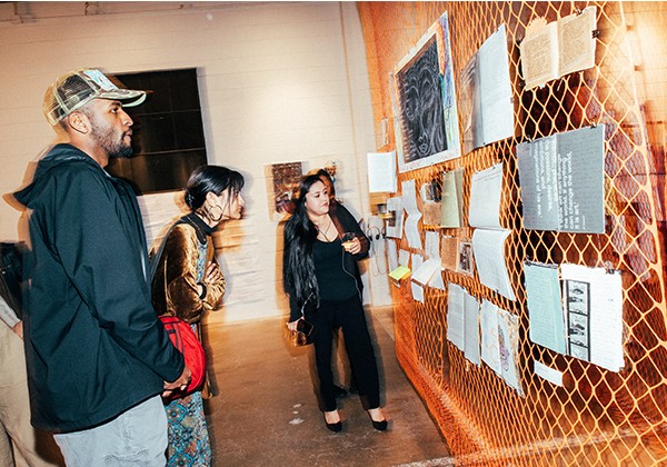 Attendees looking at Art during PGI Event