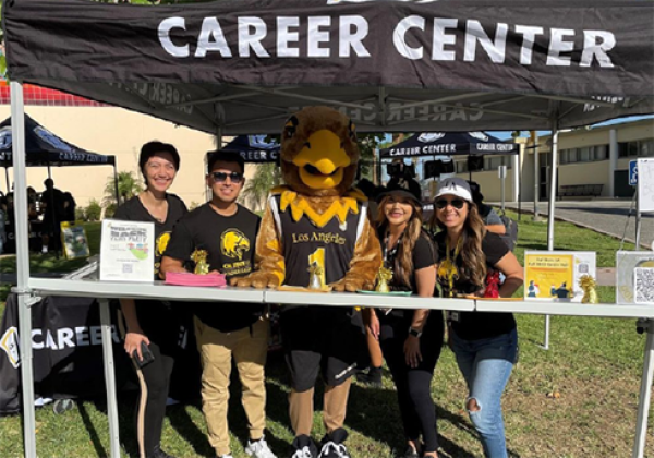 Group of staff standing in a Career Center canopy. 