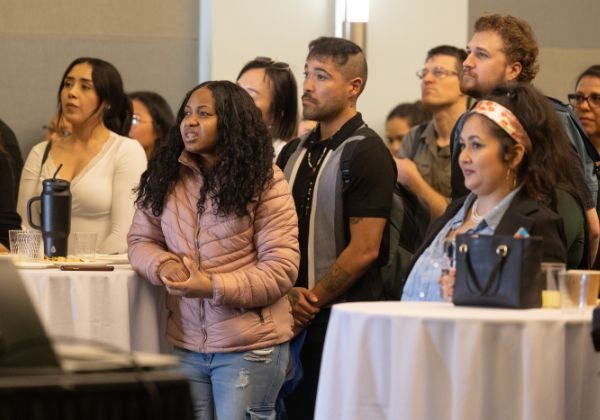 Group of people listening while standing