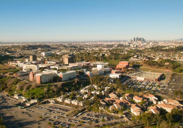 aerial drone view of Cal State LA campus with overview of Los Angeles and view of 10 freeway