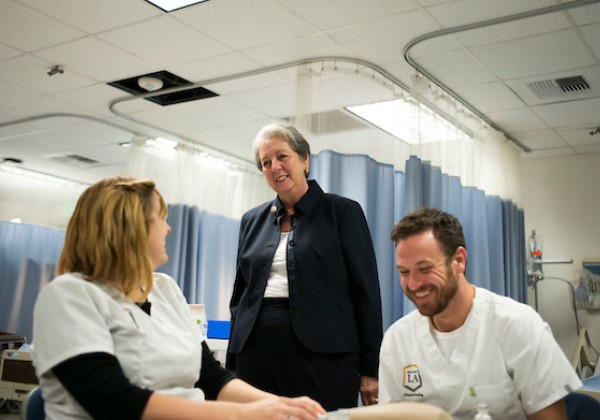 Patricia A. Chin talking to students in the simulation lab