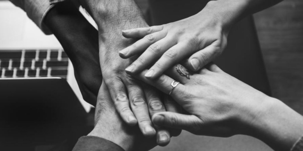 a group holding hands in unity