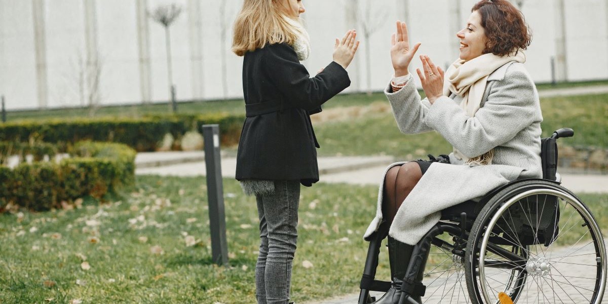 adult and child playing hand game in park