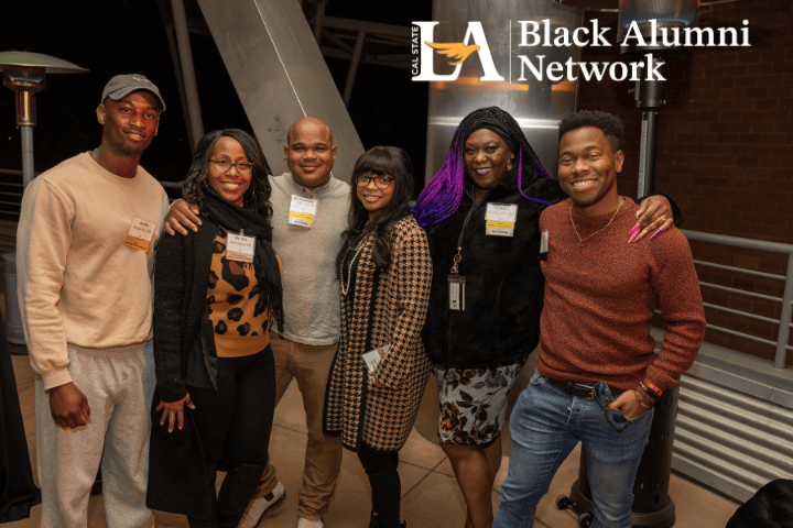 Six people posing and smiling for the camera. Overlaid text reads Cal State LA Black Alumni Network
