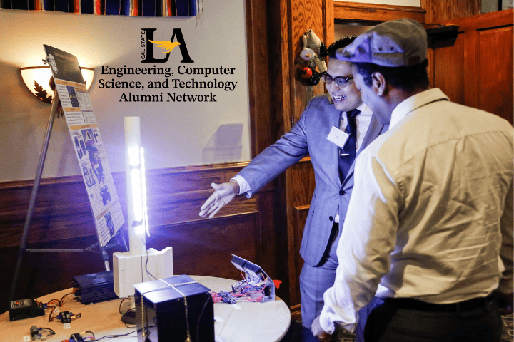 Two people smiling looking a illuminated object