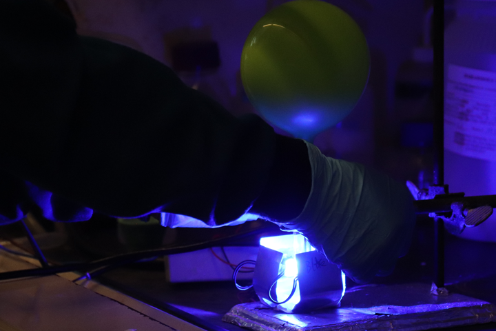 blue laser illuminates dark room