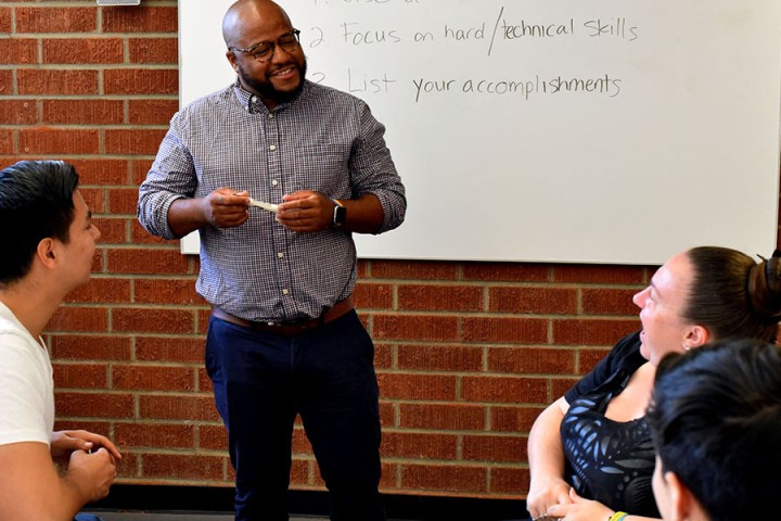 Career advisor presents career skills to students.