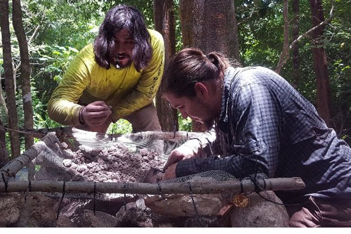 Students Jeff Rosa and classmate in the field