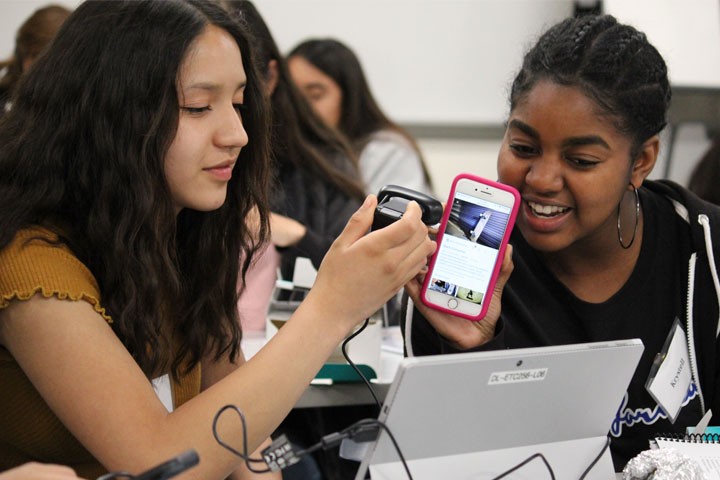 two female student in computer science portion of program