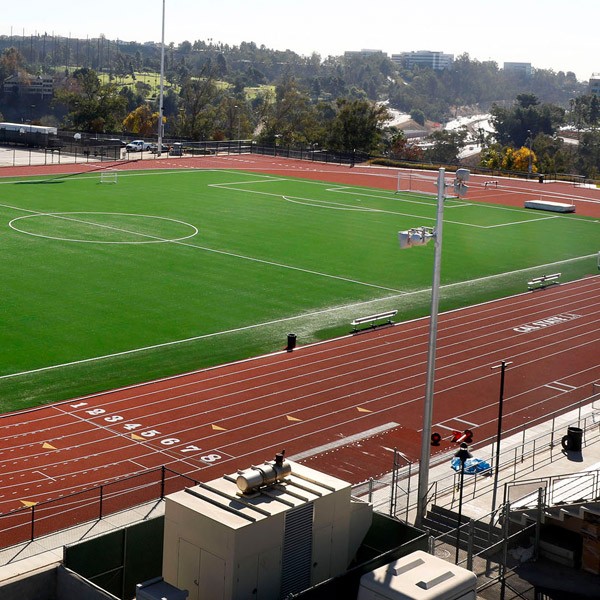 A track and field on a sunny day.