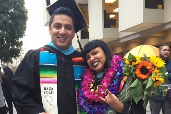 EDFN M.A. graduates Raul Meneses Samperio and Angie Barrera at Commencement, May 2018