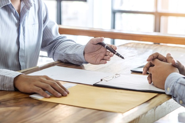 people filling out paperwork