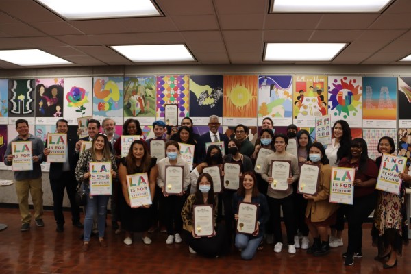 LA For All Student Showcase Students in front of their work