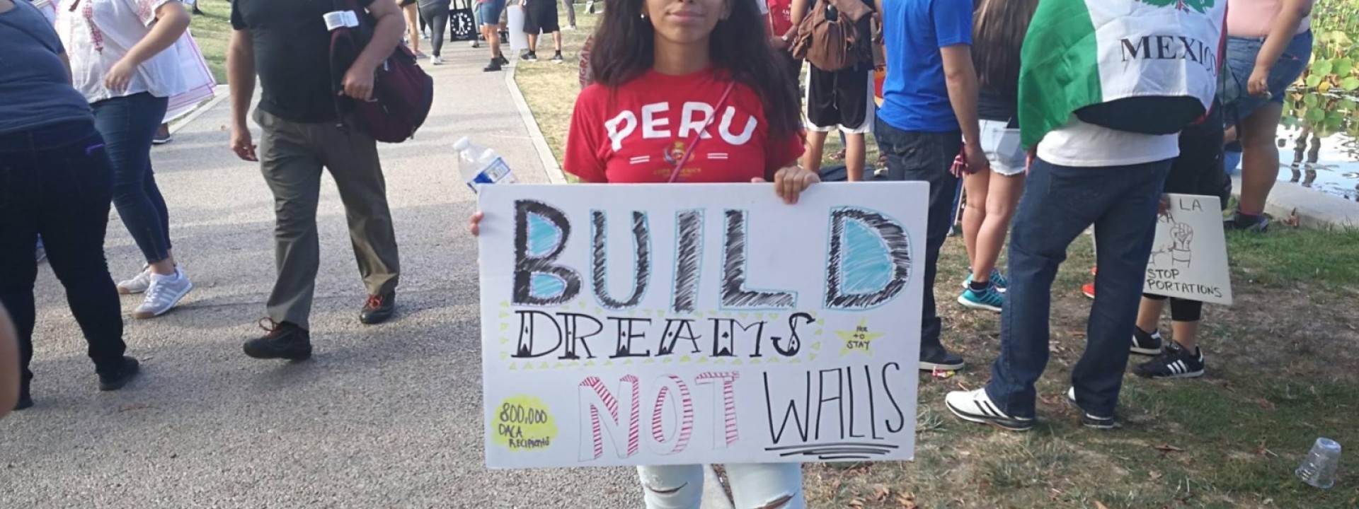 student holding a banner