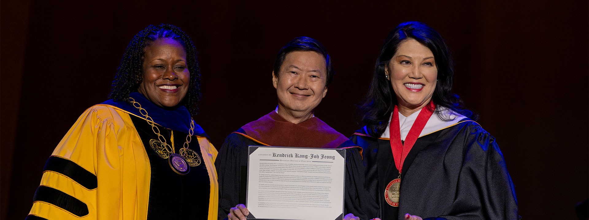 Ken Jeong receiving his honorary doctorate from President Eanes and Trustee Fong