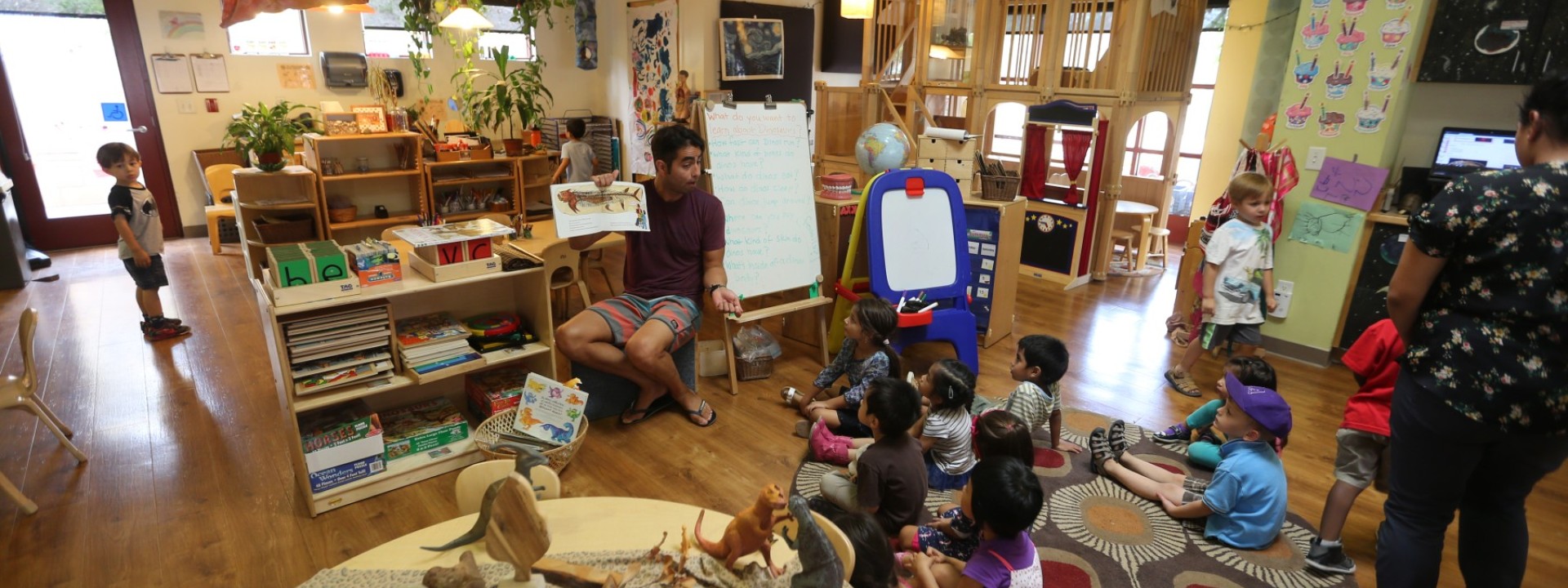 children being lectured in a seated circle