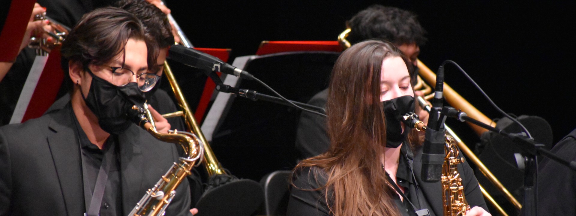 Two students playing saxophone