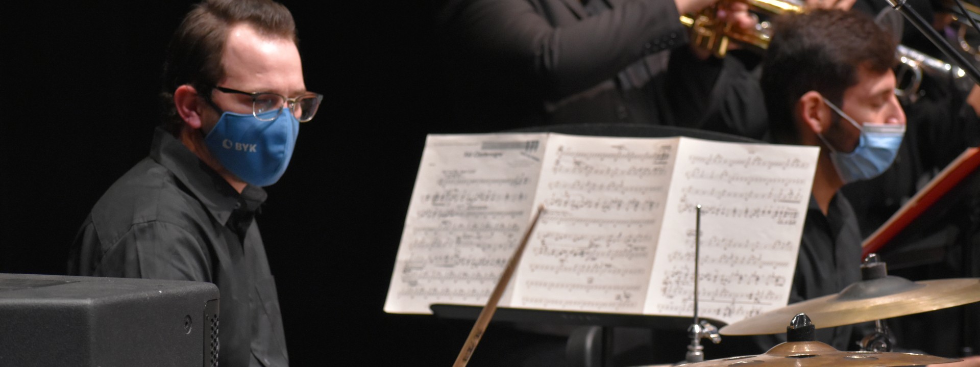 A drumset player playing in Jazz Ensemble