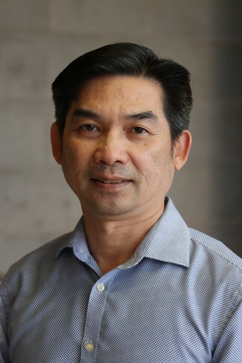 Man with blue collared t-shirt